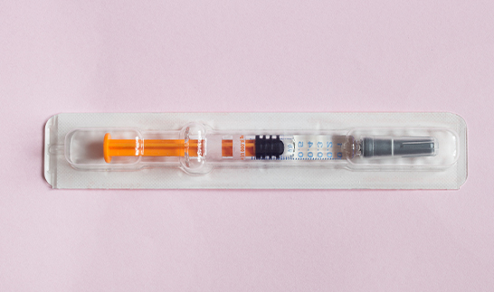 Pre-filled syringe sealed in a transparent blister pack inspected by BiSmart 2.0 AI system for defect detection, quality assurance, and compliance verification.